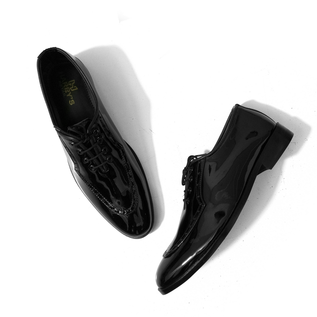 SHINNY BLACK SLIP-ONS